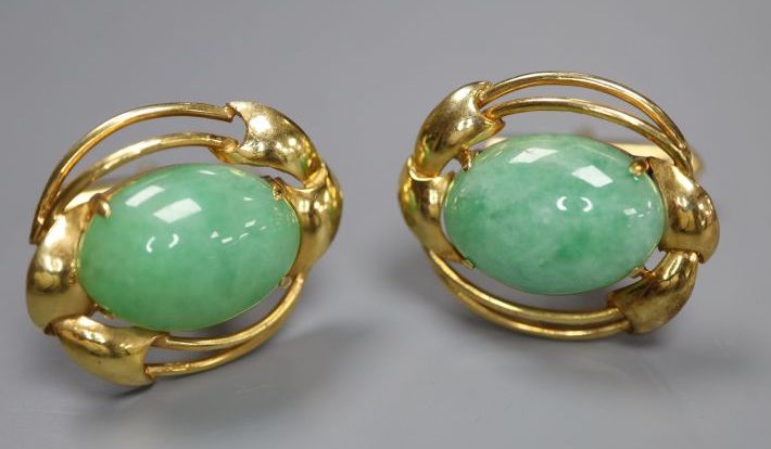 A pair of 585 yellow metal and oval cabochon jade set cufflinks, gross 12.2 grams,